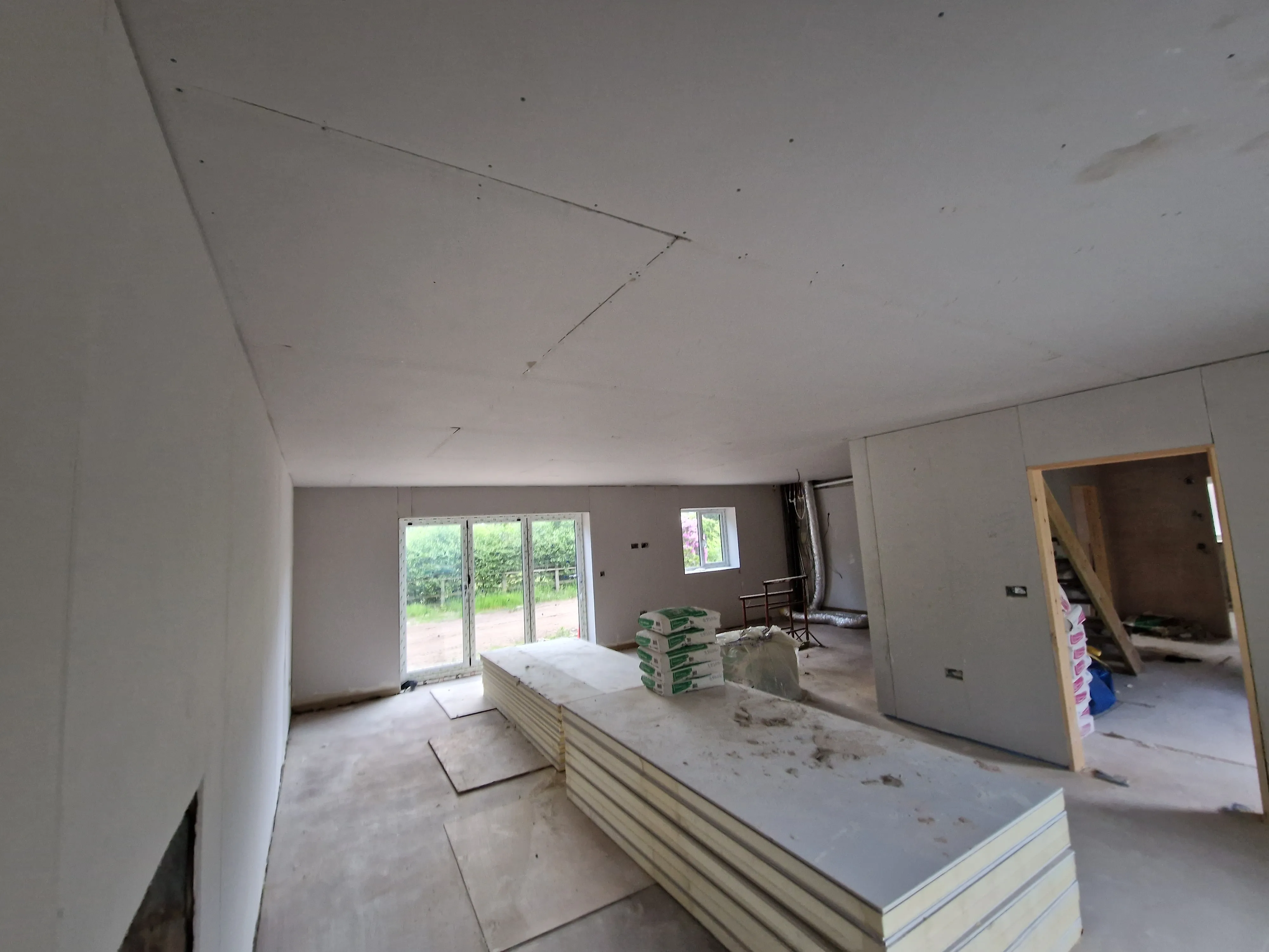 A room with a lot of unfinished furniture in it.