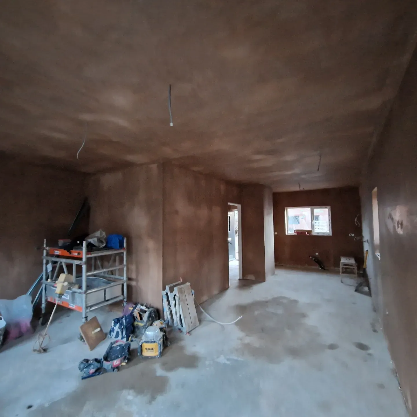A room that has a ladder in it.