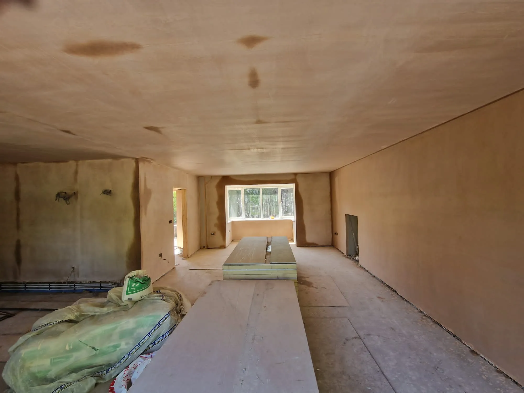 A room with a lot of unfinished furniture in it.